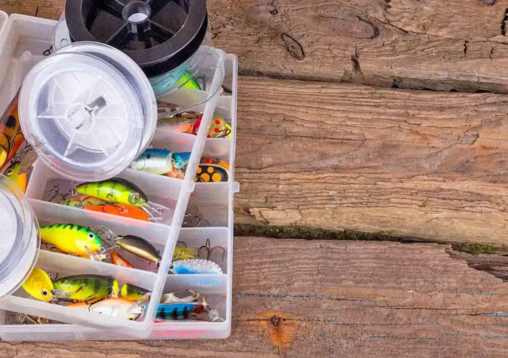 Fishing,Tackles,And,Fishing,Baits,In,Box,On,Vertical,Wooden